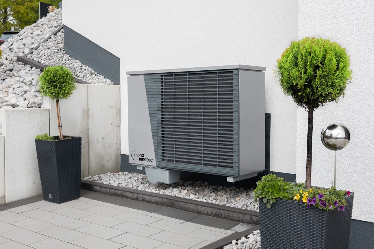 Trees and Air Conditioner by Building Wall